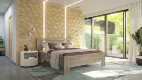 Celomasivní postel v tradičním designu